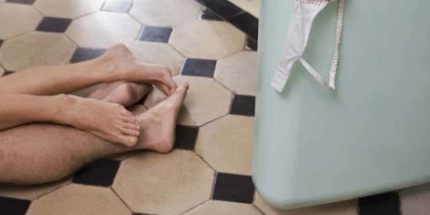 Couple lying on kitchen floor